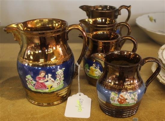 Graduated set of copper lustre jugs
